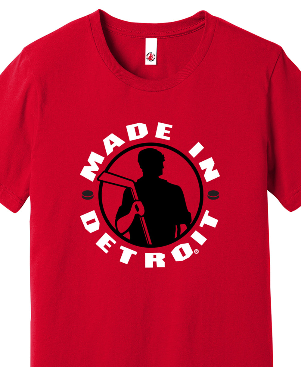 Made In Detroit Wrenchman holding a hockey stick. Printed in black/white on Red T-shirt